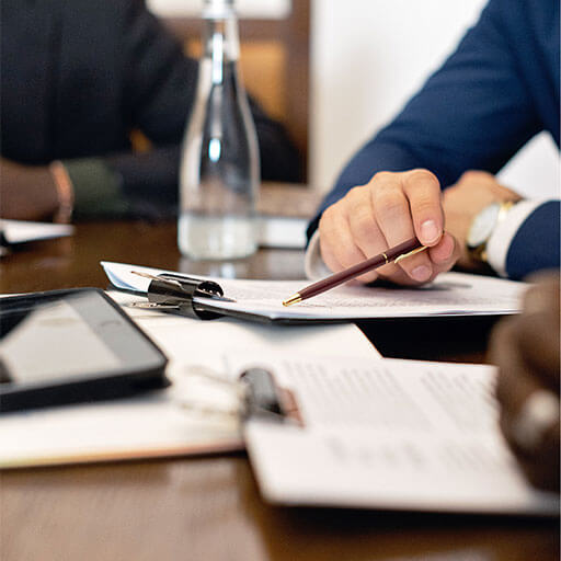 Board members in discussion on legislation documents