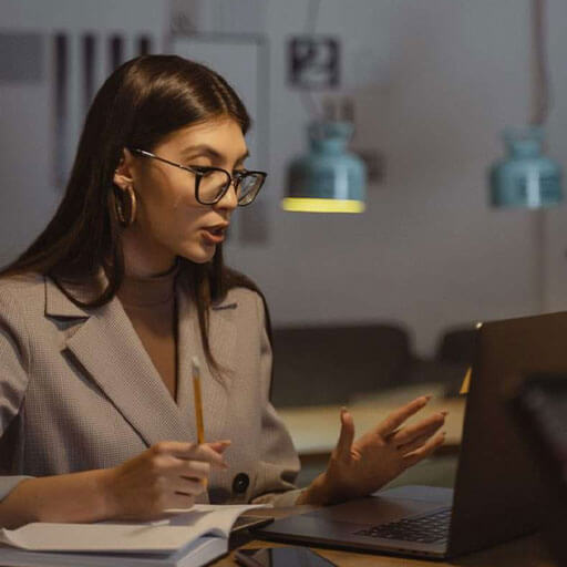 Analyst in meeting making notes